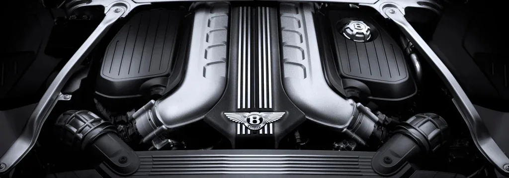 The engine bay of a luxury vehicle, immaculately maintained