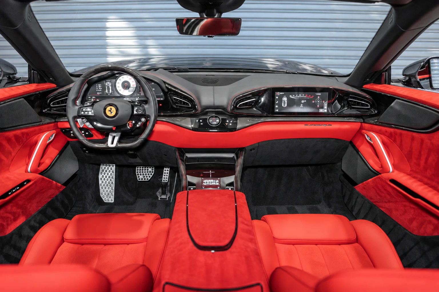Ferrari Purosangue at BLU Motors — red interior, steering wheel and dashboard