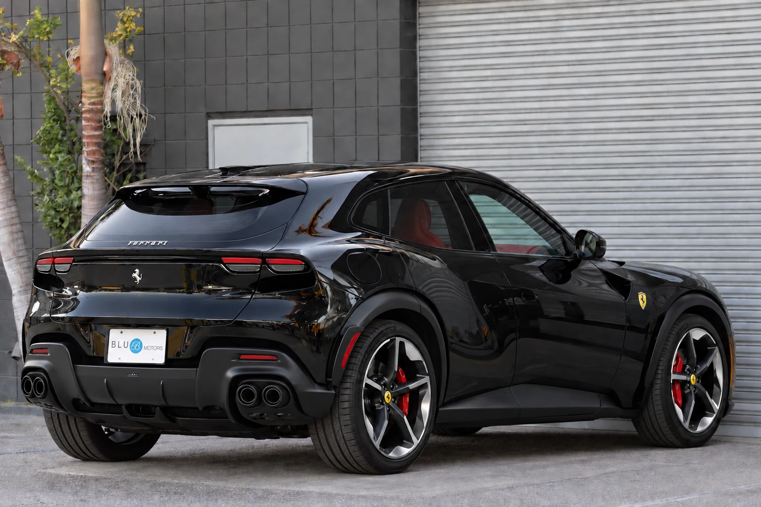 Black Ferrari Purosangue at BLU Motors — rear three-quarter view