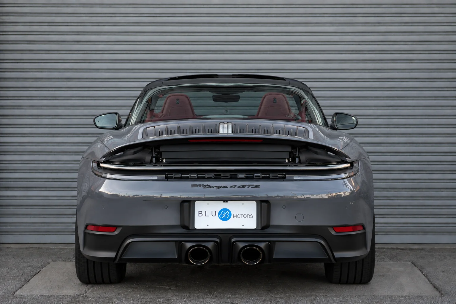 Grey Porsche 911 Targa 4 GTS — rear view with BLU Motors plate