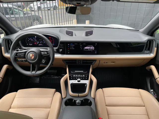 Porsche Cayenne dashboard, steering wheel and tan interior