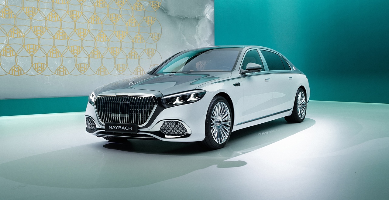 White Mercedes-Maybach sedan in a turquoise studio