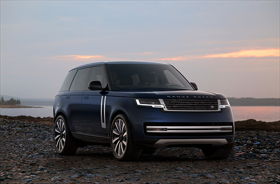 Range Rover overlooking the water at sunset