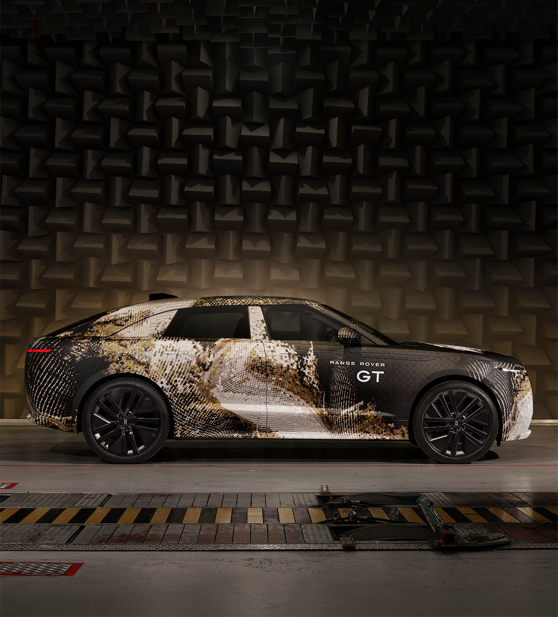 Camouflaged Range Rover GT design study in an acoustic test chamber