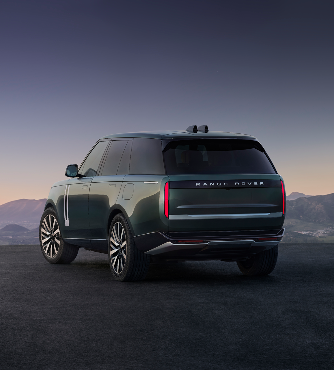 Range Rover rear profile against distant mountains
