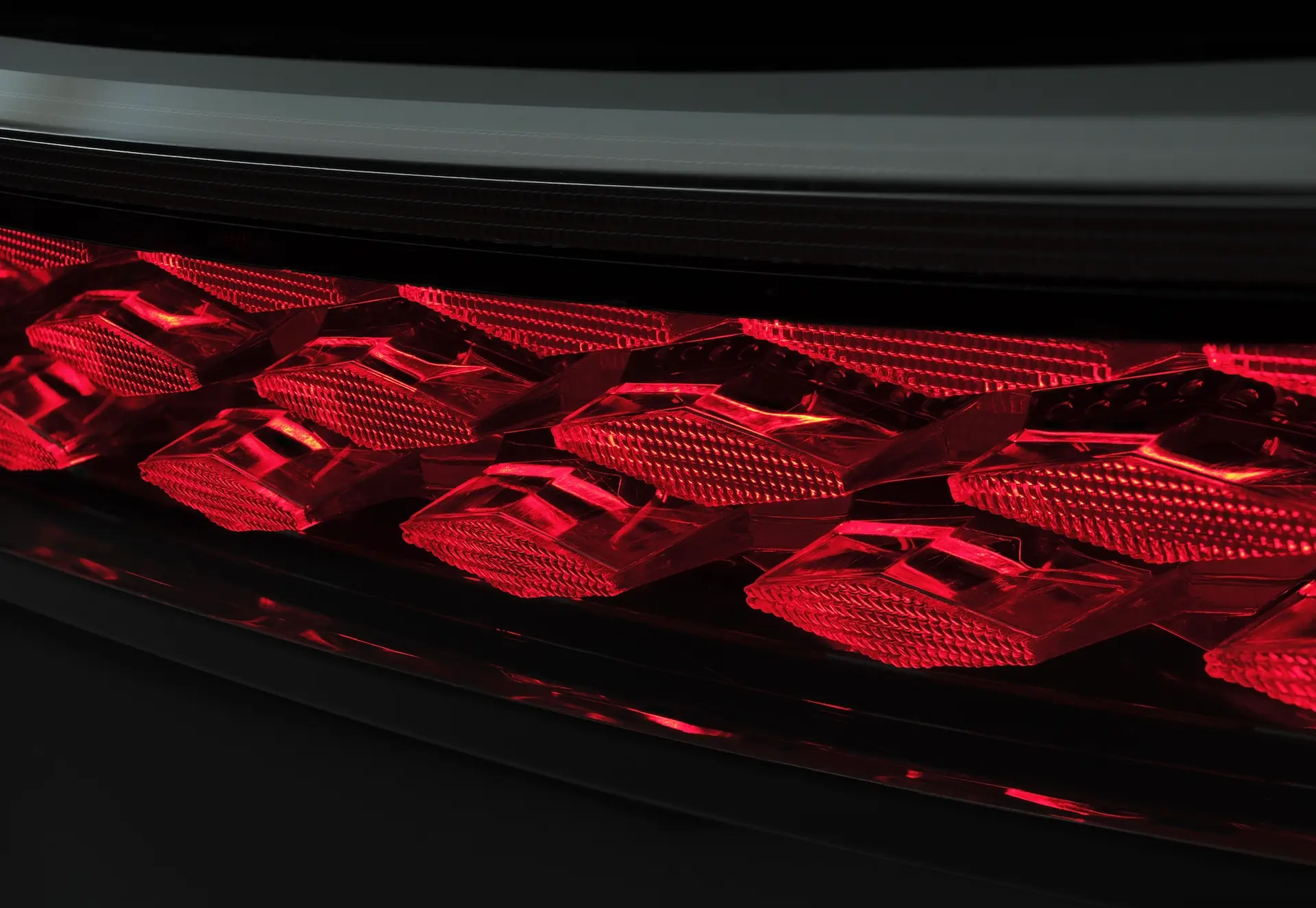 A close look at the intricate pattern of a red rear light