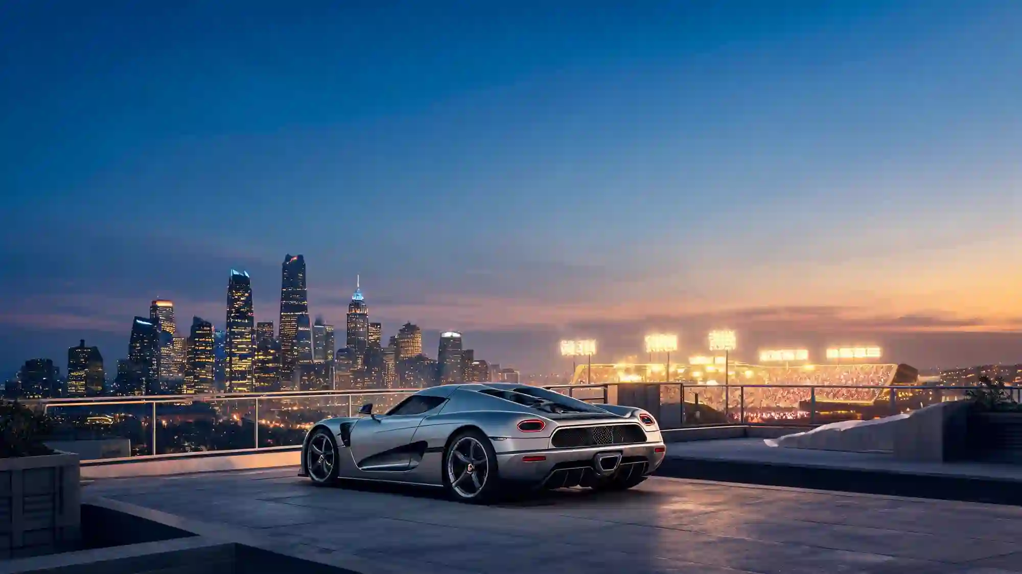 Luxury car overlooking the Los Angeles skyline and stadium lights at dusk